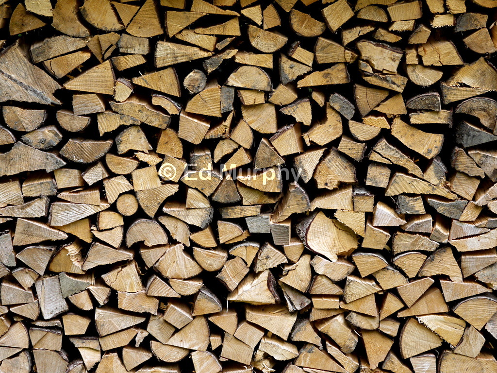 Firewood stacking art by the roadside in Kiental