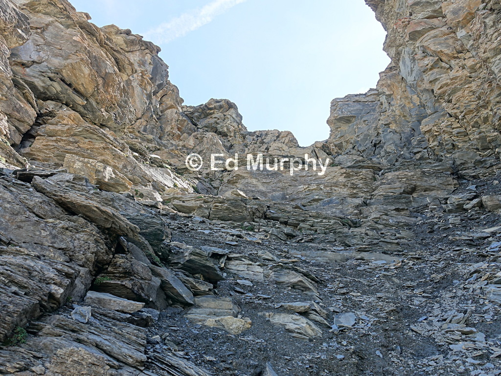 Golden walls tower above the hidden couloir on the Garde de Bordon